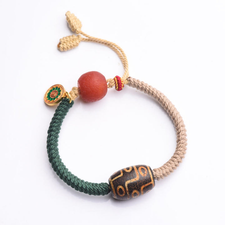 Bracelet en corde de richesse en perles tibétaines à neuf yeux Dzi fait main par Buddha Stones