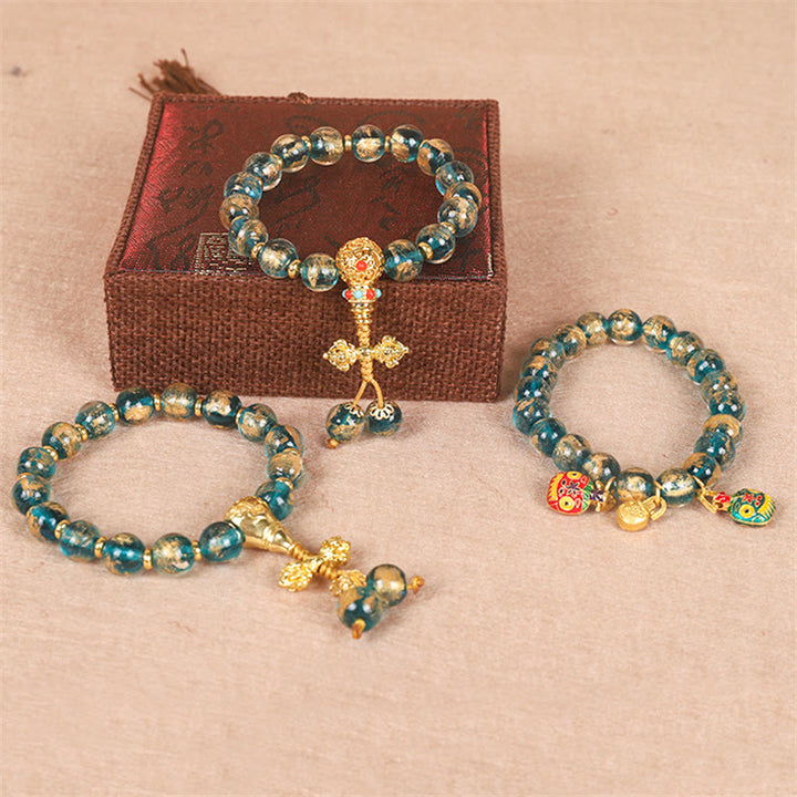 Bracelet de perles de force Dorje Vajra de la famille des bêtes avaleuses en or tibétain avec Buddha Stones