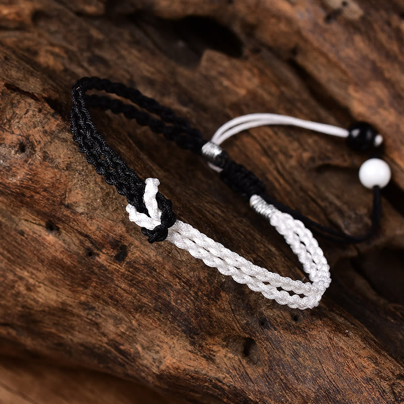 Bracelet de guérison tressé en corde noire et blanche fait main avec Buddha Stones