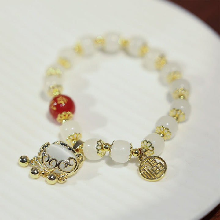 Bracelet de bénédiction avec breloque en forme de moulin à vent en Buddha Stones et caractère Fu