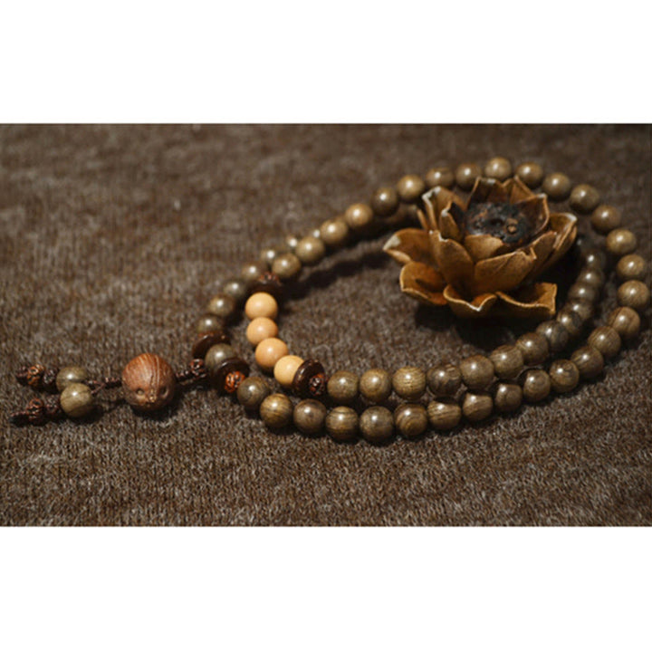 Bracelet Mala avec breloque de protection en bois de santal tibétain et Buddha Stones
