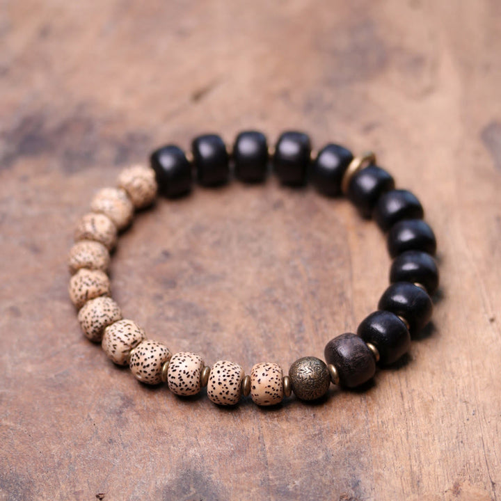 Bracelet de paix en cuivre et bois d'ébène avec Buddha Stones et graines de Bodhi tibétaines