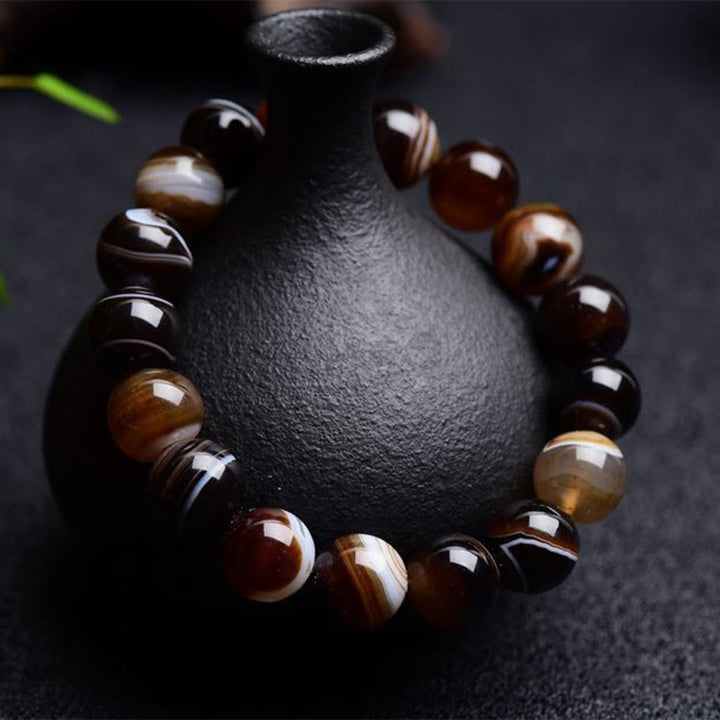 Bracelet de bonheur positif tibétain en sardonyx Buddha Stones