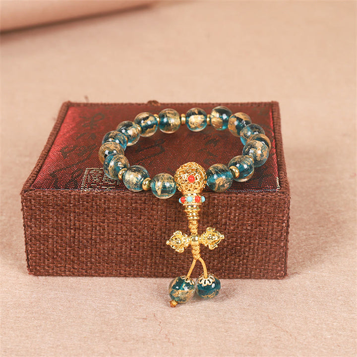 Bracelet de perles de force Dorje Vajra de la famille des bêtes avaleuses en or tibétain avec Buddha Stones