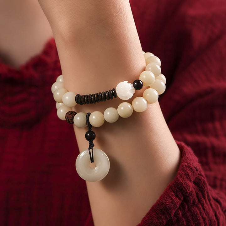 Bracelet double tour en harmonie avec boucle de paix en bois de santal vert et graines de Bodhi et Buddha Stones