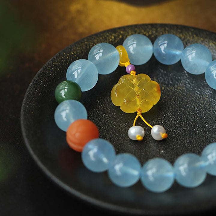 Bracelet de paix avec breloque en ambre et aigue-marine naturelle