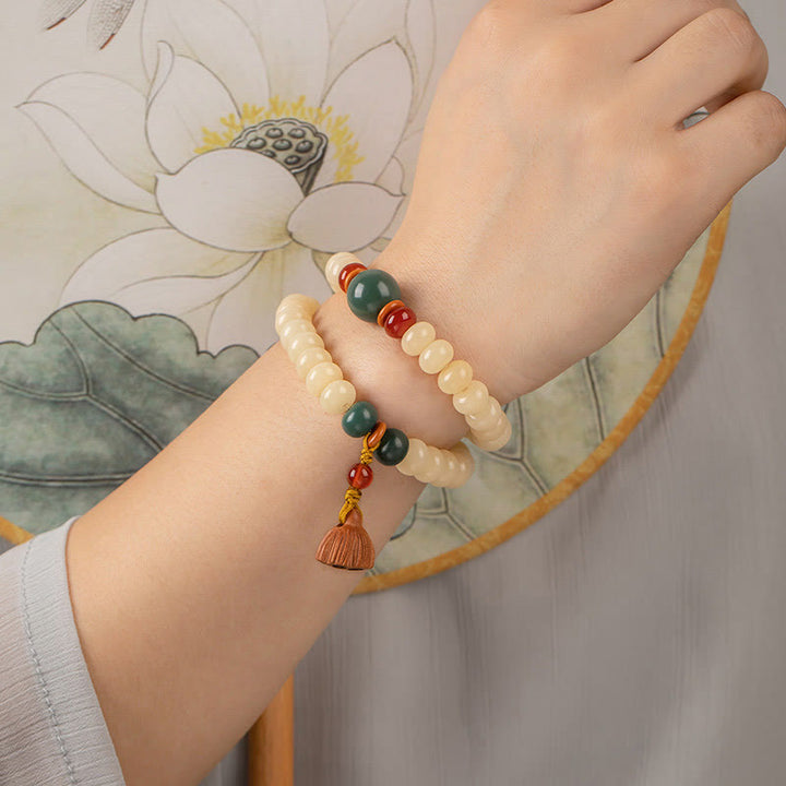 Bracelet double tour avec breloque en forme de gousse de lotus et graines de Bodhi et Buddha Stones