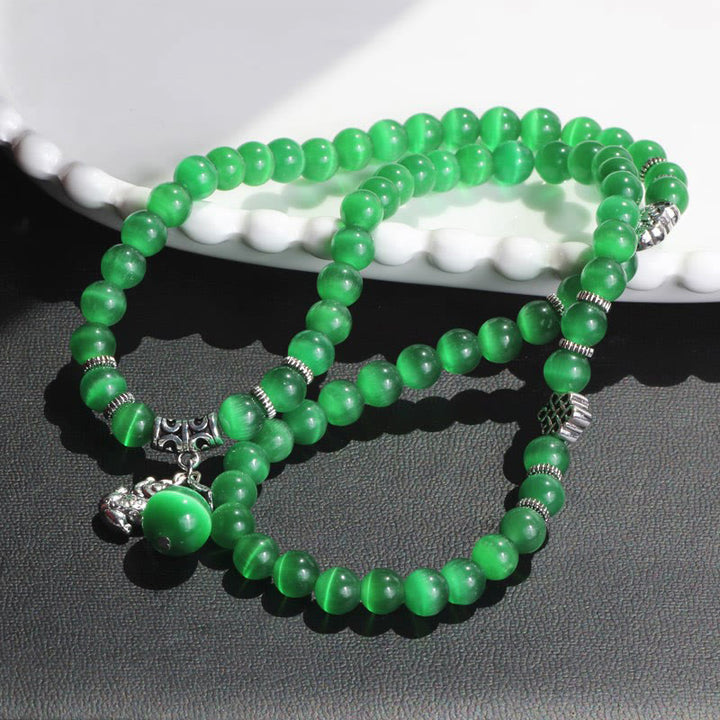 Bracelet triple tour de soutien PiXiu œil de chat en Buddha Stones