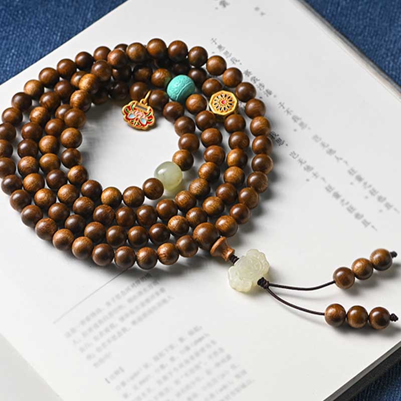 Bracelet Mala tibétain de protection et de calme en bois de rose avec Buddha Stones