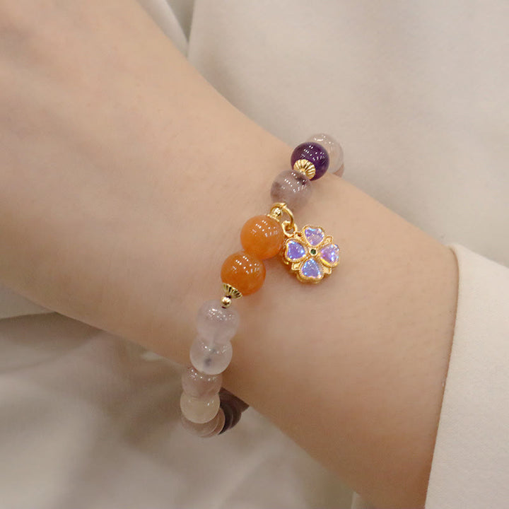 Bracelet de richesse en perles de jade violet doré en Buddha Stones