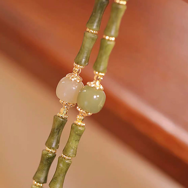 Bracelet porte-bonheur en jade Hetian péridot plaqué cuivre 14 carats avec Buddha Stones et motif bambou