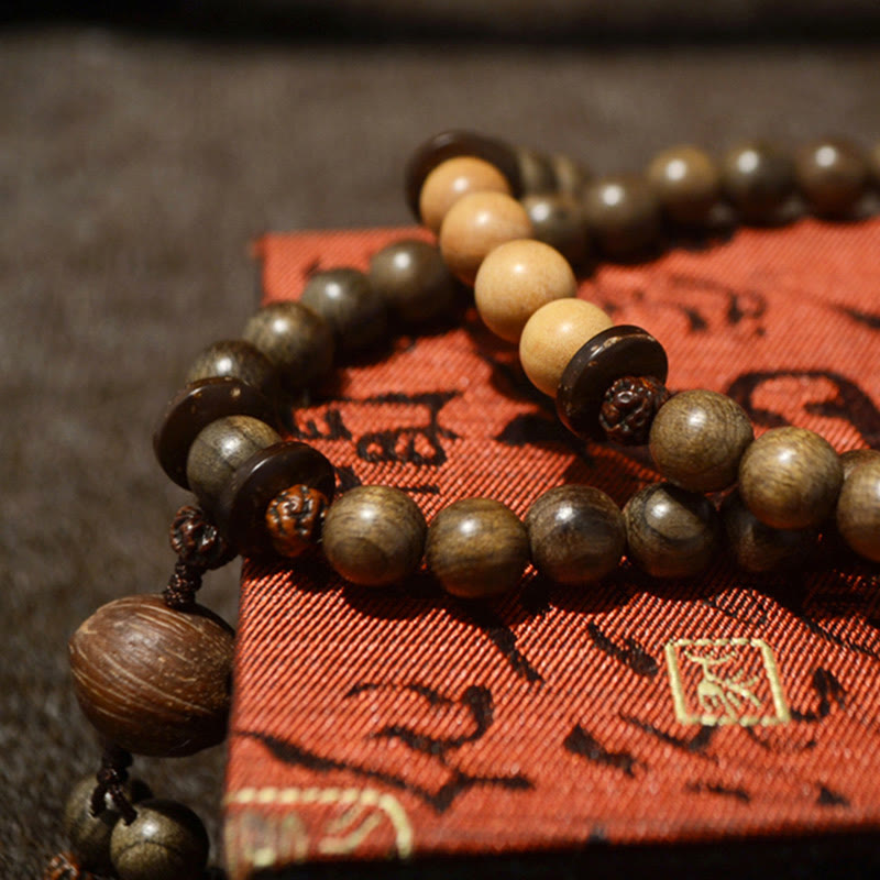 Bracelet Mala avec breloque de protection en bois de santal tibétain et Buddha Stones