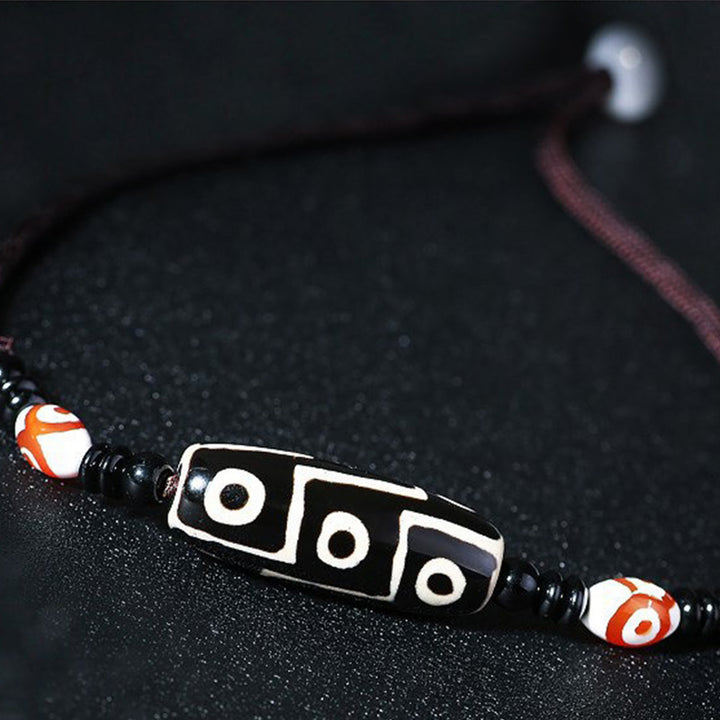 Collier de protection en perles tibétaines à neuf yeux Dzi Buddha Stones