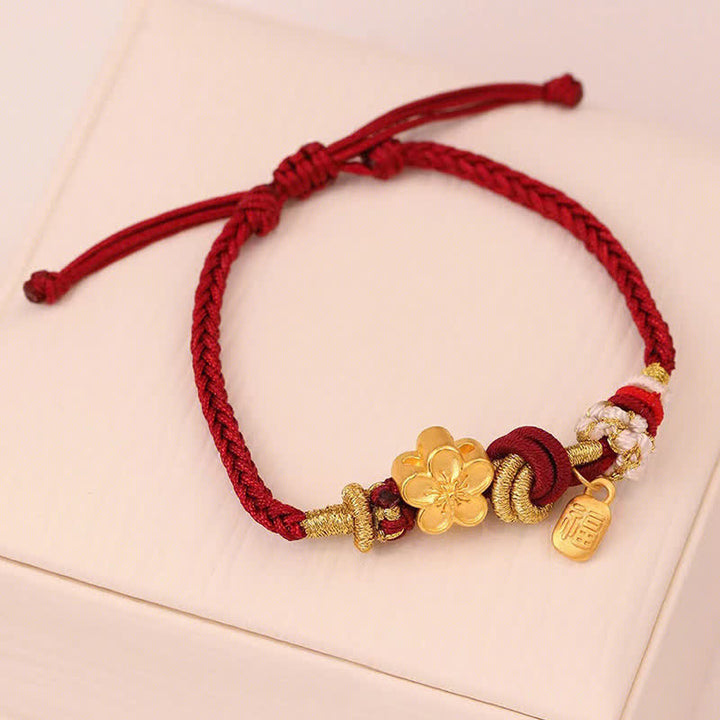 Bracelet porte-bonheur en fil rouge avec Buddha Stones et fleur de pêcher