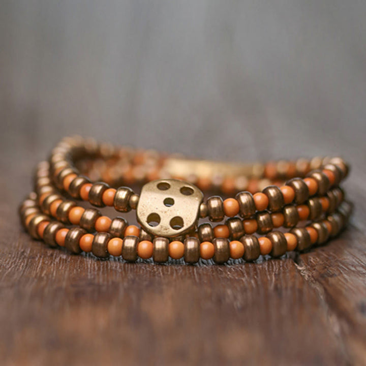 Bracelet de richesse rétro en cuivre avec noyau d'olive et Buddha Stones