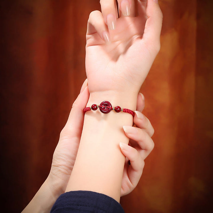 Bracelet de bénédiction en corde avec boucle de paix en cinabre naturel et Buddha Stones