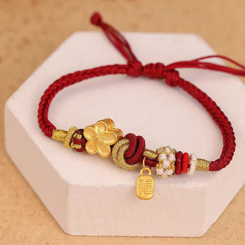 Bracelet porte-bonheur en fil rouge avec Buddha Stones et fleur de pêcher