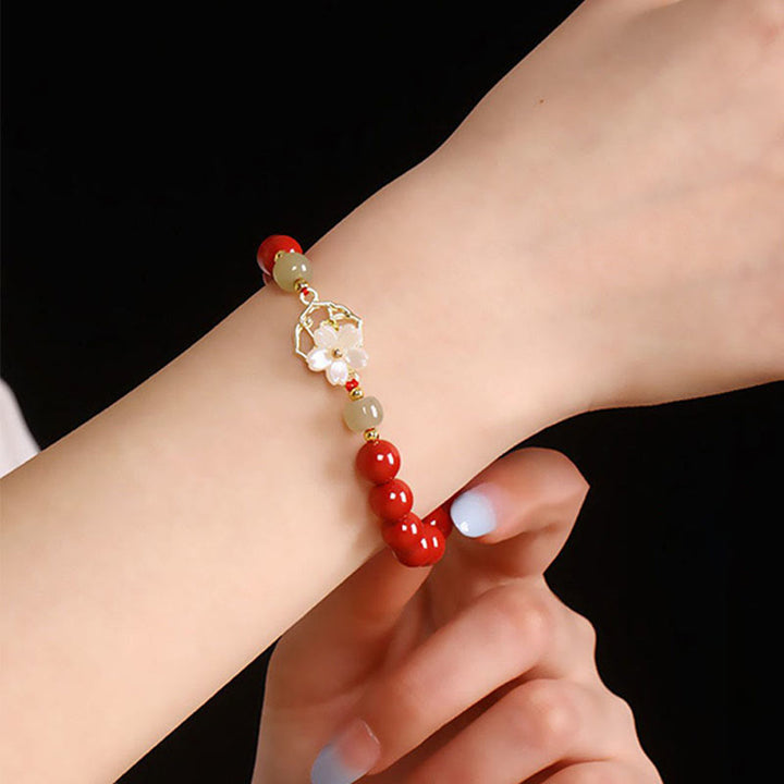 Bracelet de bénédiction en pierre de cinabre naturelle et jade Tridacna avec Buddha Stones