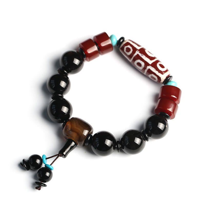 Bracelet tibétain de protection de richesse en onyx noir avec perles dzi à neuf yeux