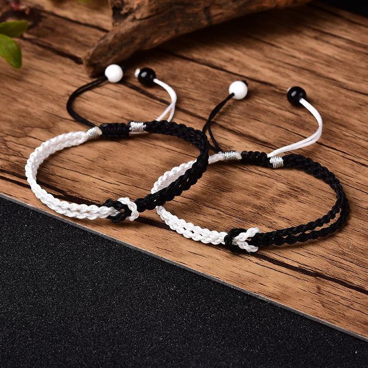 Bracelet de guérison tressé en corde noire et blanche fait main avec Buddha Stones