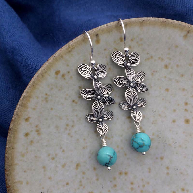 Boucles d'oreilles pendantes en argent sterling 925 avec Buddha Stones , turquoise, lazurite et lapis-lazuli, motif fleur et feuille, symbole de sérénité et de protection. - Turquoise et argent sterling 925 - image 0