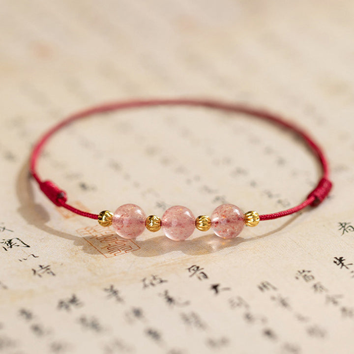 Bracelet de cheville en fil rouge avec perles en cristal de fraise et Buddha Stones