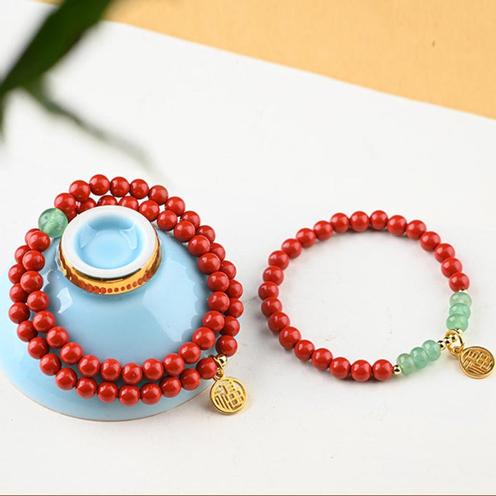 Collier porte-bonheur tibétain en aventurine verte et cinabre avec Buddha Stones