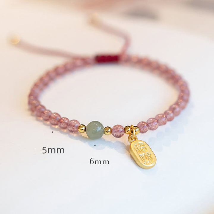 Bracelet porte-bonheur en Buddha Stones, quartz fraise, grenat, jade, caractère Fu