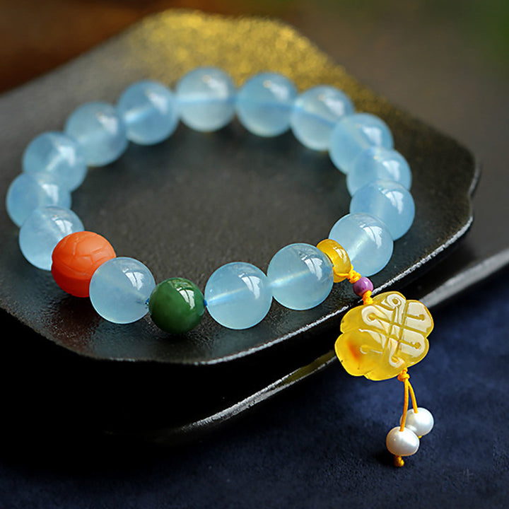 Bracelet de paix avec breloque en ambre et aigue-marine naturelle