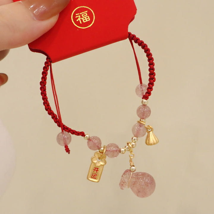 Bracelet tressé en fil rouge avec breloque de guérison en quartz fraise naturel et Buddha Stones