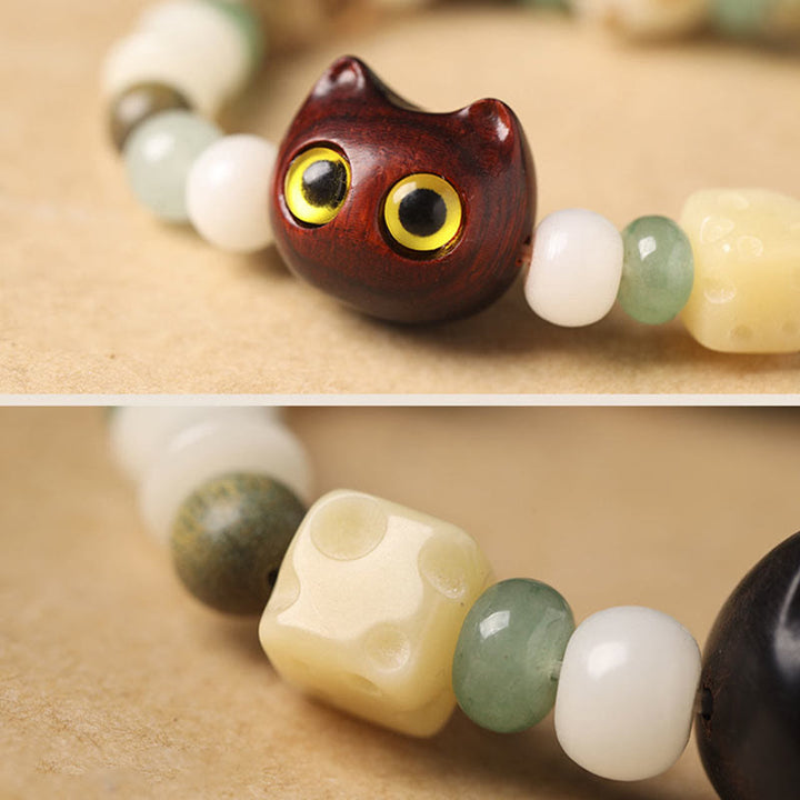 Buddha Stones Graine de Bodhi Bois de santal vert Bois d'ébène Petite feuille Bois de santal rouge Tête de chat Patte Griffe Bracelet de paix - image 9