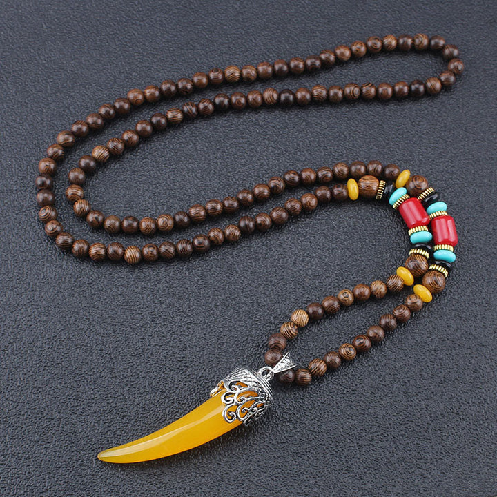 Collier pendentif de méditation en bois de wengé et pierre turquoise de style corne