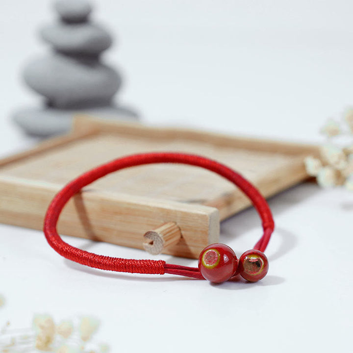 Bracelet en céramique rouge porte-bonheur Feng Shui Buddha Stones et fil rouge - image 1