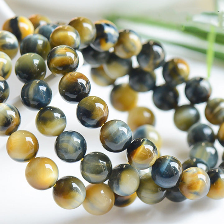 Bracelet de force, de courage et de protection en œil de tigre avec Buddha Stones