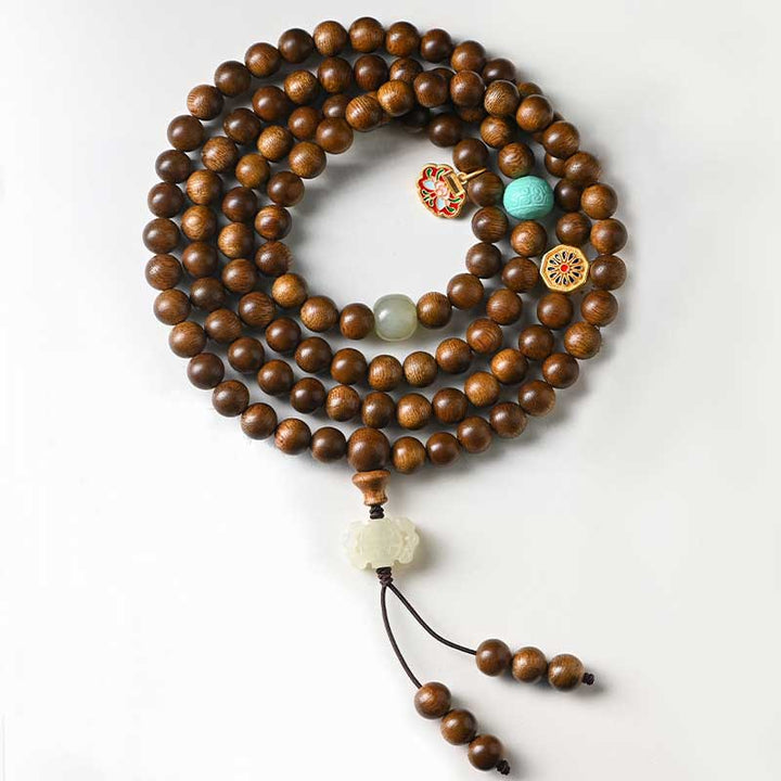 Bracelet Mala tibétain de protection et de calme en bois de rose avec Buddha Stones