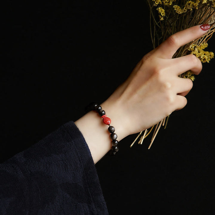 Bracelet de protection apaisante en obsidienne et cinabre avec Buddha Stones et reflets argentés naturels