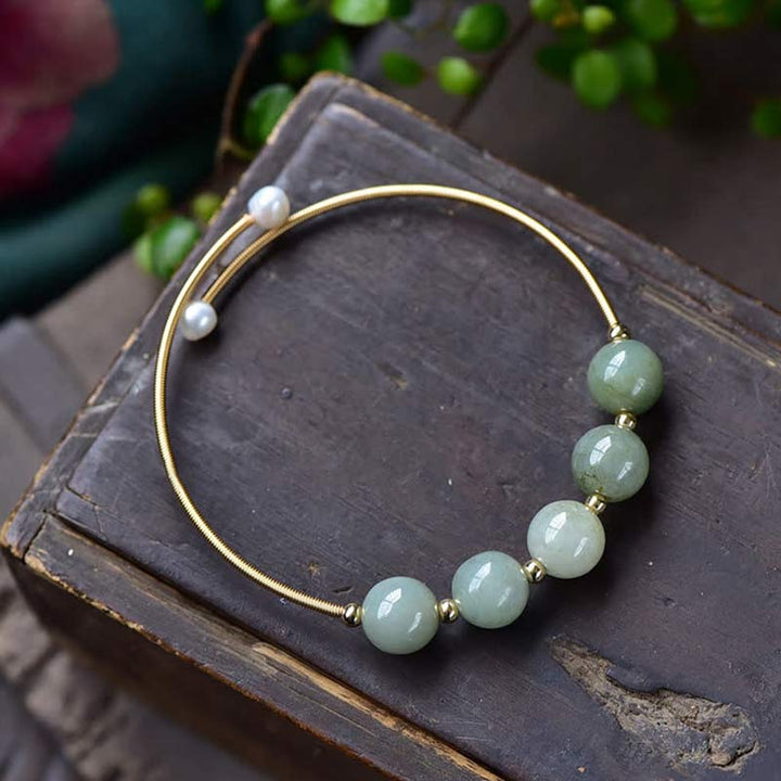 Bracelet jonc en jade avec Buddha Stones et bénédictions pour la chance et l'abondance