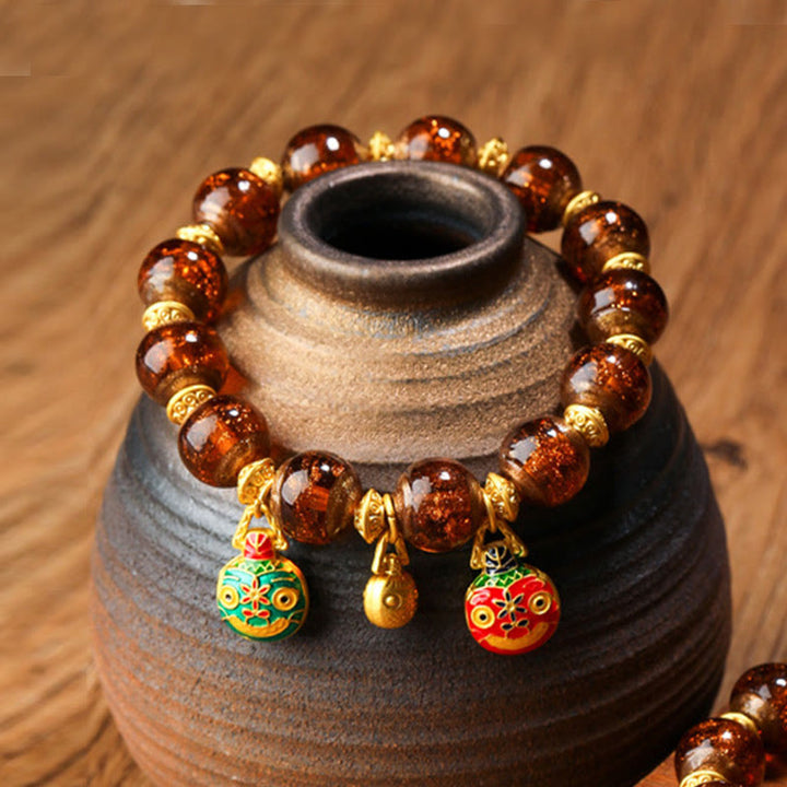 Bracelet porte-bonheur en perles de verre Liuli avec breloque de la famille des bêtes avaleuses en or et Buddha Stones - Brun - Famille de bêtes avaleuses d'or - 12 mm - image 17