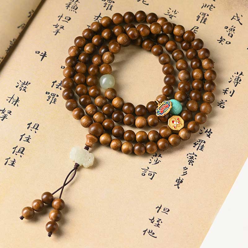 Bracelet Mala tibétain de protection et de calme en bois de rose avec Buddha Stones