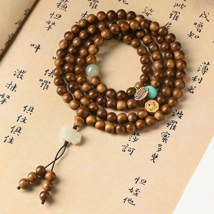 Bracelet Mala tibétain de protection et de calme en bois de rose avec Buddha Stones