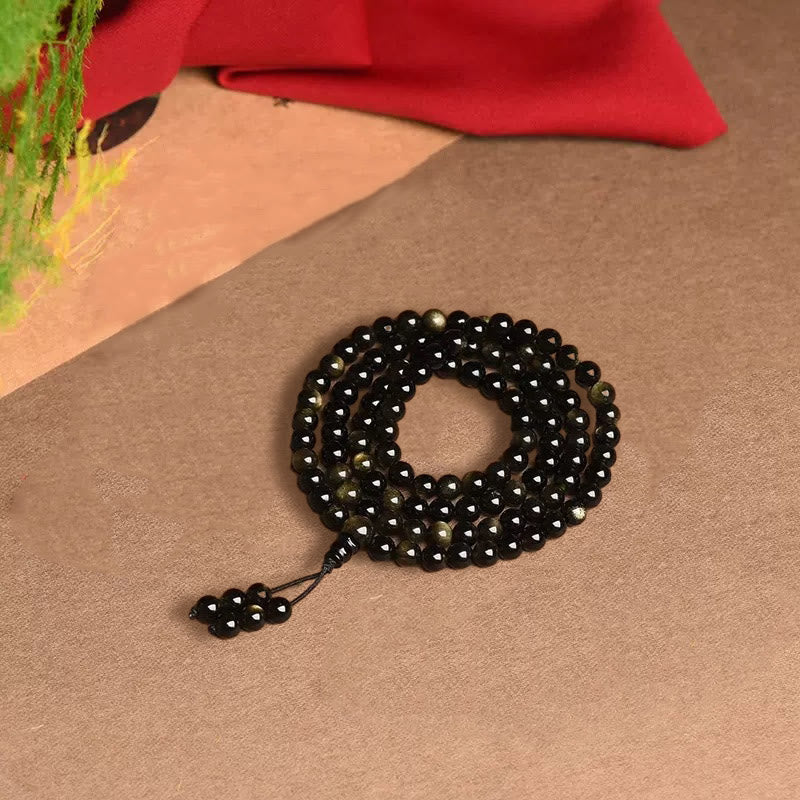 Bracelet de richesse en obsidienne naturelle dorée avec 108 perles de Mala Buddha Stones