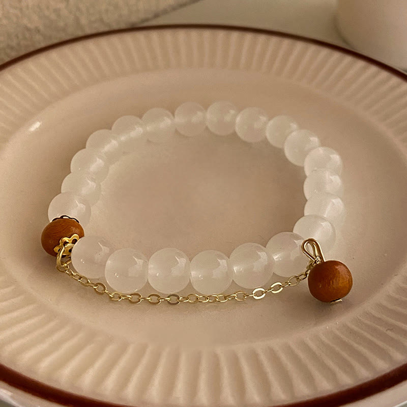 Bracelet de protection à breloques en bois de santal et œil de chat Fu avec Buddha Stones