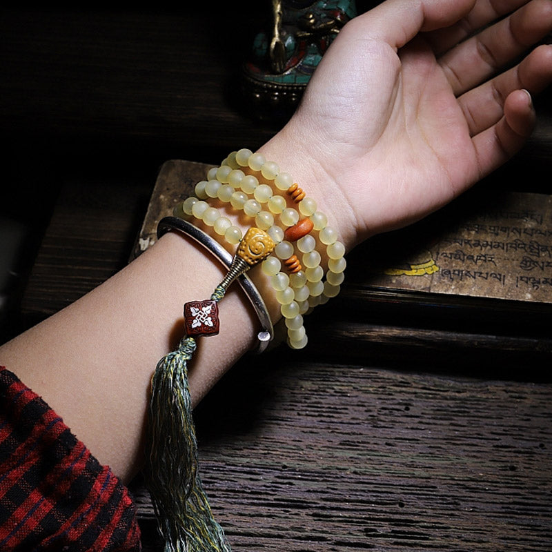 Bracelet porte-bonheur en ambre avec 108 Buddha Stones de Mala en corne de mouton du Tibet
