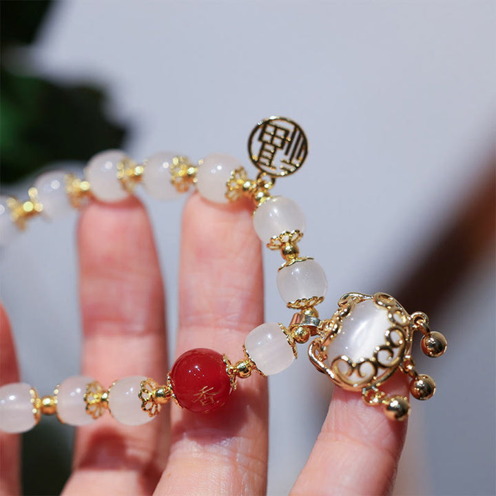Bracelet de bénédiction avec breloque en forme de moulin à vent en Buddha Stones et caractère Fu