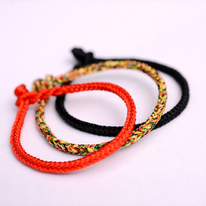 Bracelet tibétain en corde tressée à huit fils avec nœud de paix et protection fait main en Buddha Stones