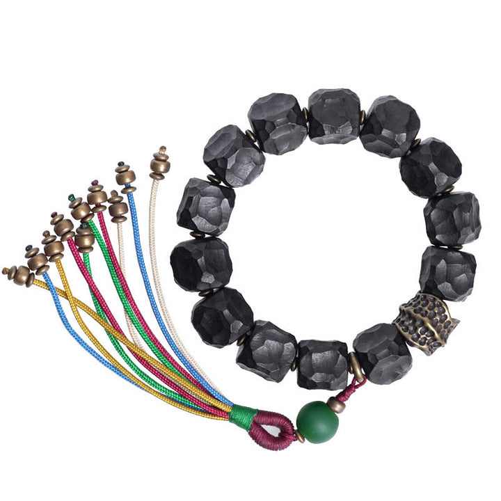 Bracelet Mala en bois d'ébène et cuivre avec Buddha Stones et pompon de paix