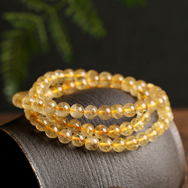 Bracelet de protection et de prospérité en Buddha Stones en citrine naturelle