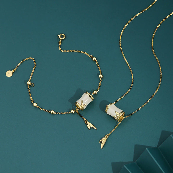 Collier pendentif porte-bonheur en feuille de bambou en jade blanc Hetian en argent sterling 925 et or 22 carats avec Buddha Stones
