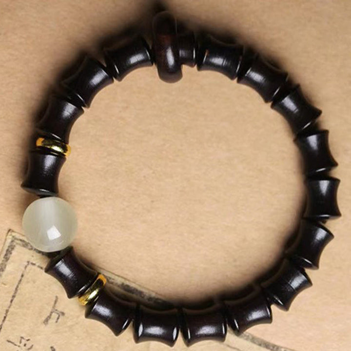 Bracelet de paix en bambou et bois de santal vert et ébène avec Buddha Stones
