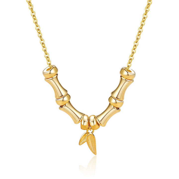 Collier pendentif en acier titane avec motif de bambou doré et Buddha Stones